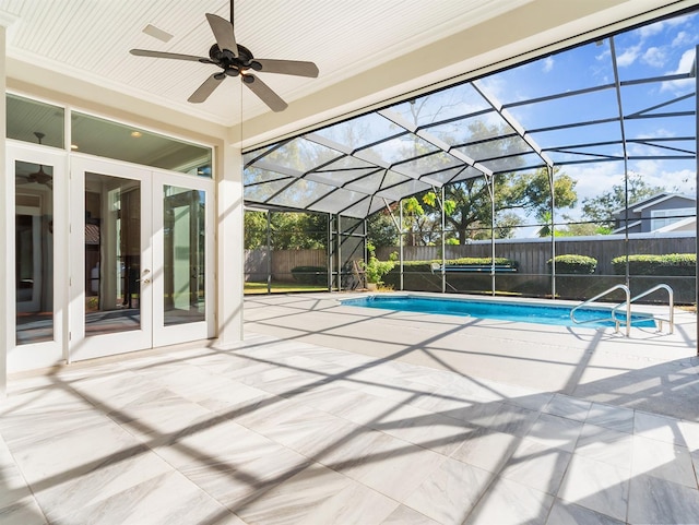 view of pool with a lanai, a patio area, and french doors