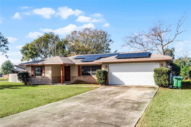 ranch-style house featuring a garage, a front lawn, and solar panels