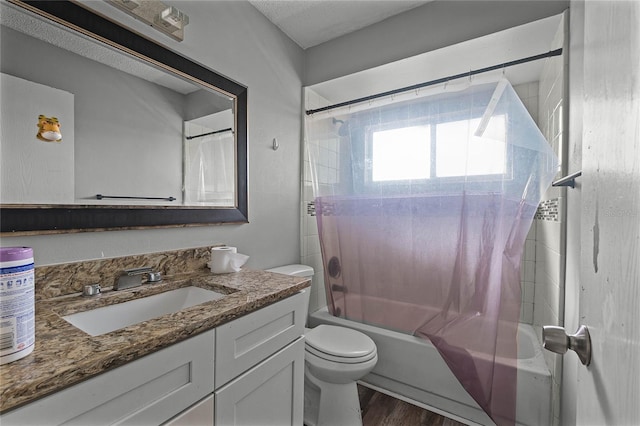 full bathroom with vanity, hardwood / wood-style flooring, shower / bath combination with curtain, and toilet