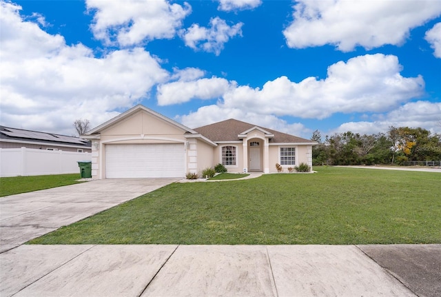 ranch-style home featuring a garage and a front lawn