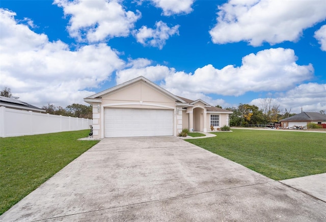 view of front facade with a garage and a front lawn