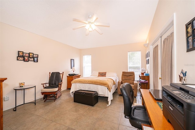 bedroom with ceiling fan and light tile patterned floors