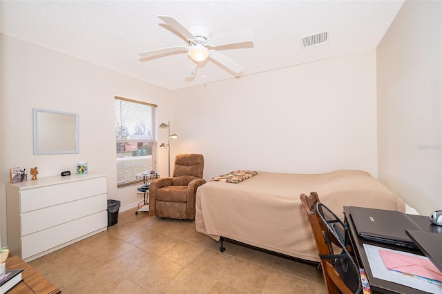 tiled bedroom with ceiling fan