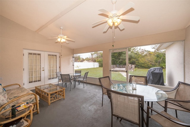 sunroom / solarium featuring french doors, ceiling fan, and lofted ceiling with beams