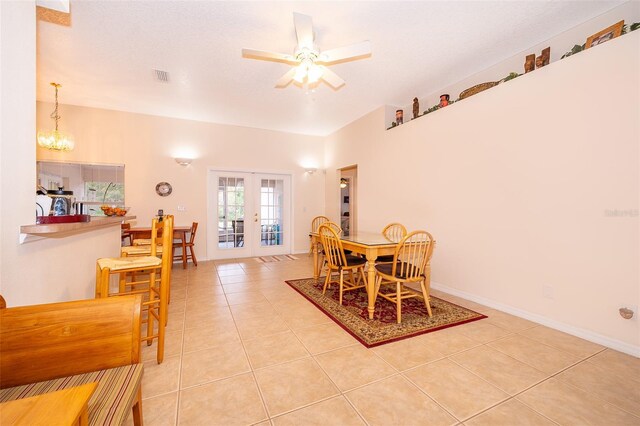dining room featuring french doors, light tile patterned floors, baseboards, visible vents, and ceiling fan