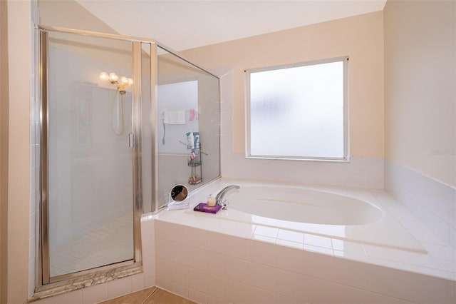 full bath with a stall shower and a bath