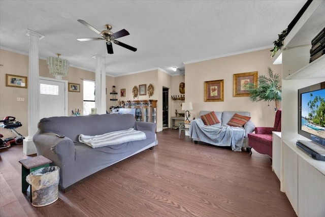 living room featuring ornate columns, ceiling fan, a textured ceiling, and dark hardwood / wood-style flooring