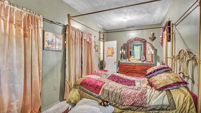 carpeted bedroom with a textured ceiling