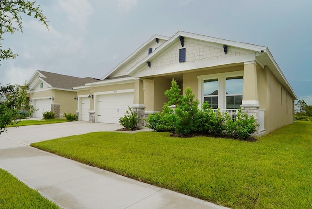 view of front of house with a garage, covered porch, and a front lawn