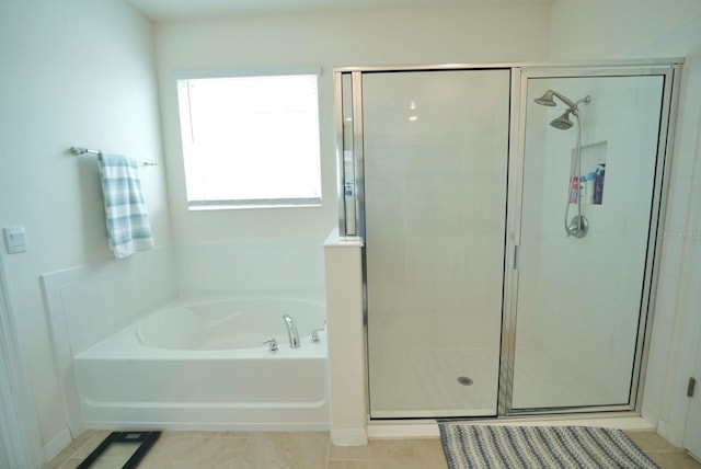 bathroom featuring tile patterned floors and plus walk in shower