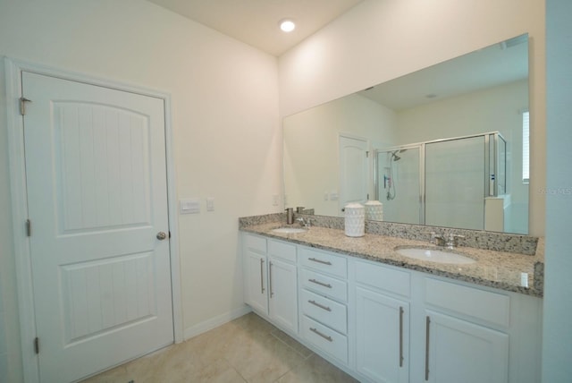 bathroom with vanity, tile patterned floors, and walk in shower