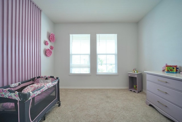 bedroom with light carpet