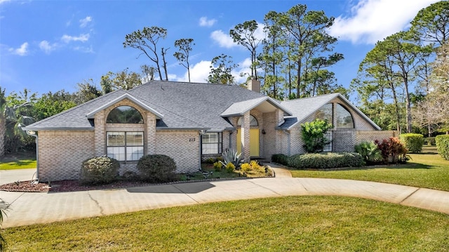 ranch-style home featuring a front yard