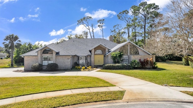 ranch-style home with a front lawn