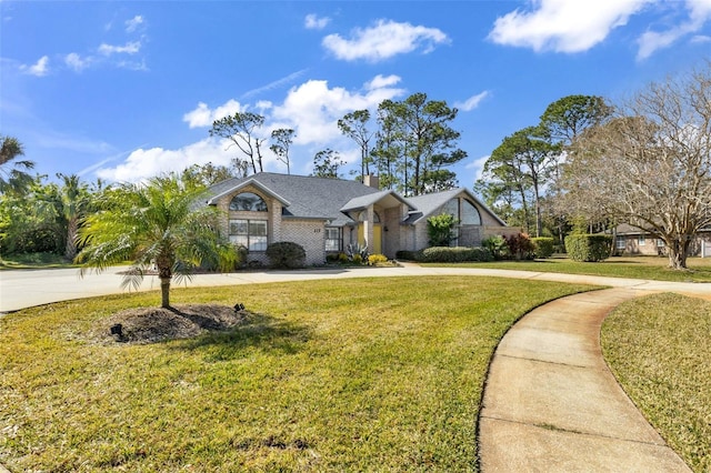 single story home featuring a front yard