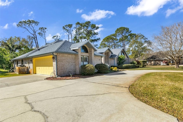 view of front of home with a garage and a front yard