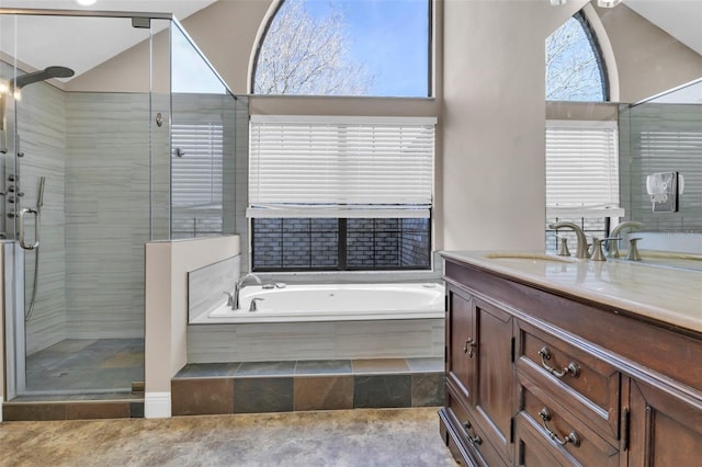 bathroom with vanity, separate shower and tub, and lofted ceiling