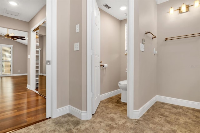 bathroom featuring toilet and ceiling fan