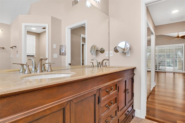 bathroom featuring vanity, wood-type flooring, and ceiling fan