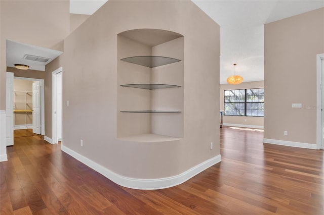 hall with hardwood / wood-style flooring