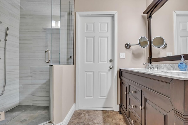 bathroom featuring walk in shower and vanity