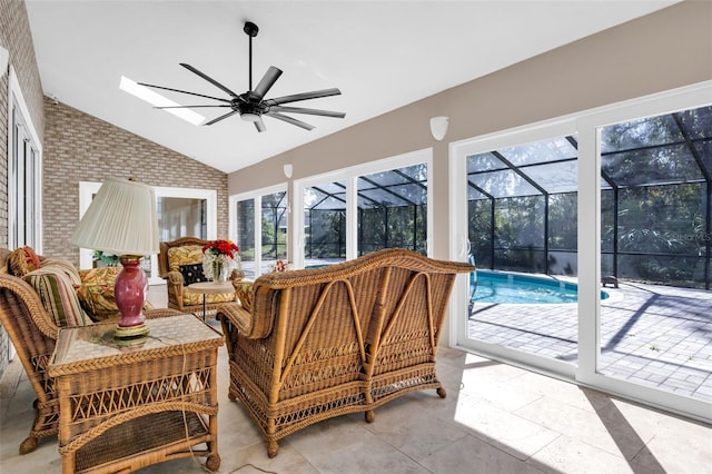 sunroom / solarium with ceiling fan and lofted ceiling