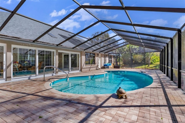 view of pool featuring a lanai and a patio