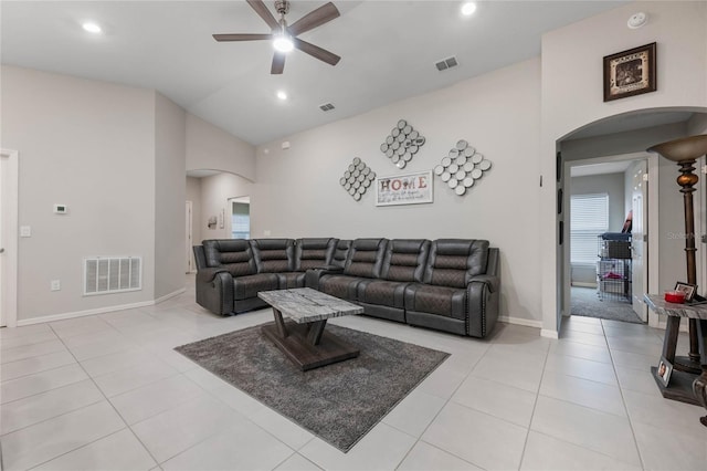 tiled living room featuring ceiling fan