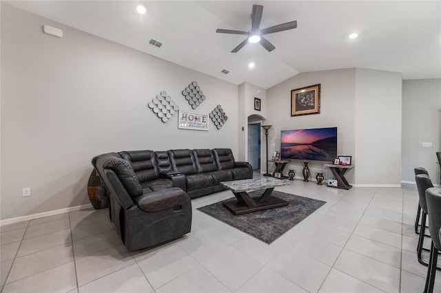 tiled living room featuring ceiling fan and vaulted ceiling