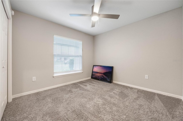 unfurnished bedroom featuring a closet, ceiling fan, and carpet flooring