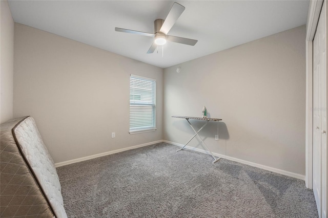 interior space with ceiling fan