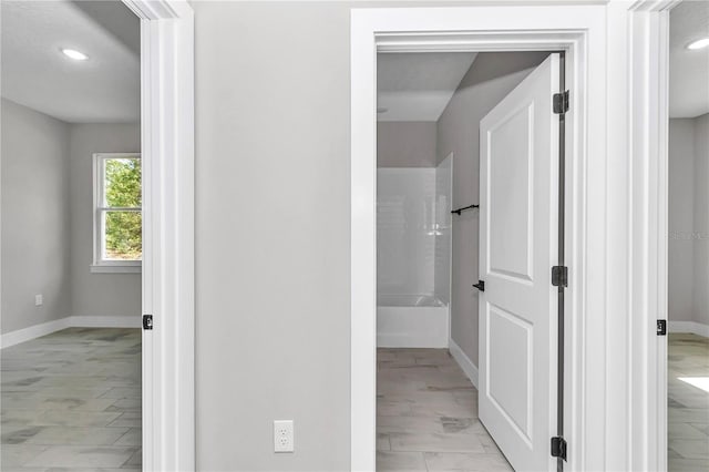 9095 SW 125th Ter, Dunnellon, FL 34432 - corridor with baseboards, recessed lighting, and light marble finish floors