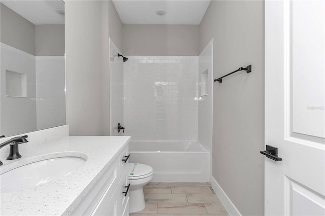 9095 SW 125th Ter, Dunnellon, FL 34432 - bathroom with vanity, toilet, washtub / shower combination, marble finish floors, and baseboards