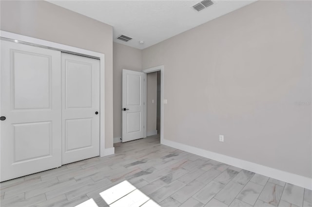 9095 SW 125th Ter, Dunnellon, FL 34432 - unfurnished bedroom with a closet and baseboards