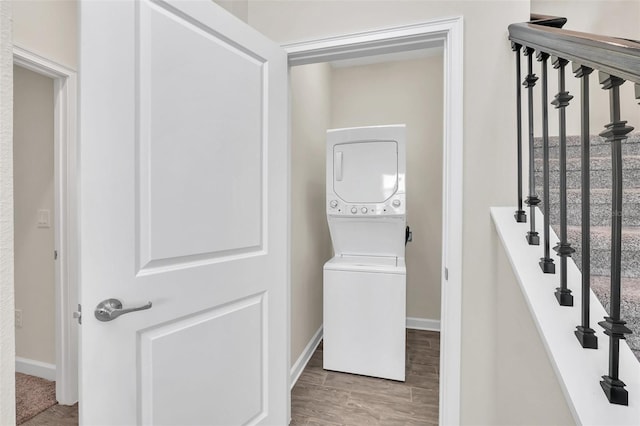 washroom with stacked washer and dryer