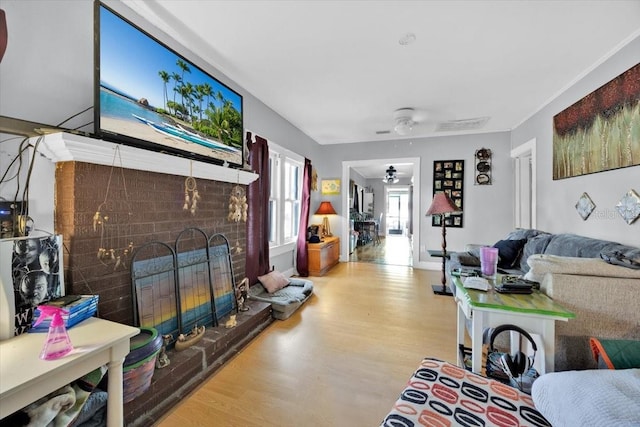 living room featuring a fireplace and light hardwood / wood-style flooring