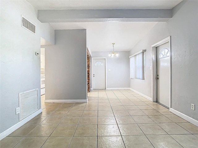 unfurnished room featuring beamed ceiling, light tile patterned floors, and a chandelier