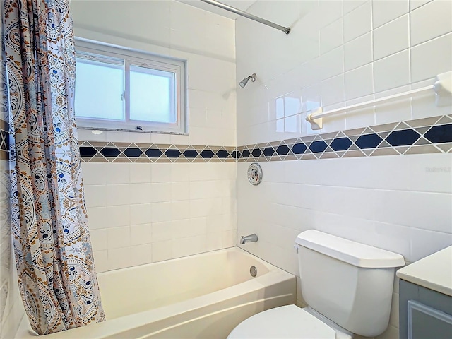 full bathroom with vanity, shower / bath combo with shower curtain, and toilet