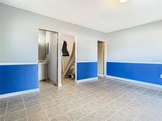 spare room with tile patterned floors