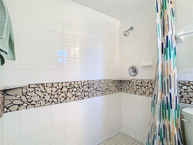 bathroom with a shower with curtain and toilet