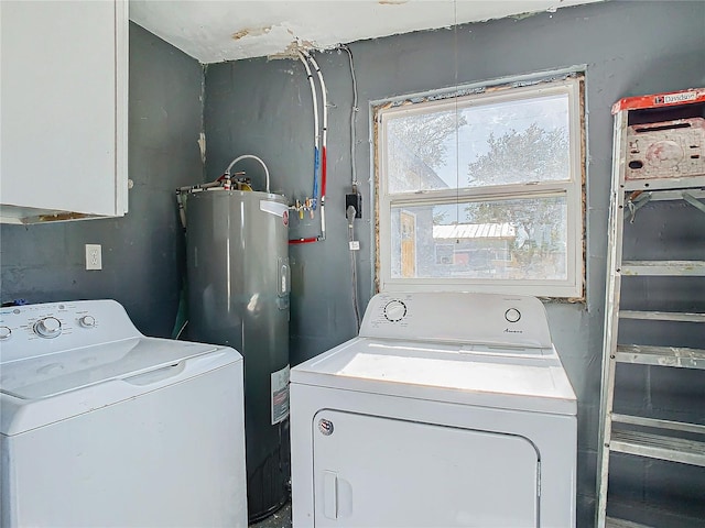 washroom with washing machine and dryer and electric water heater