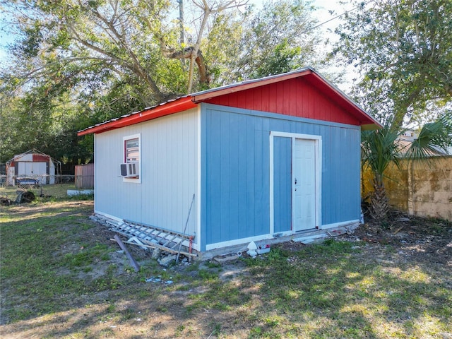 view of outbuilding with a yard and cooling unit