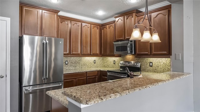 kitchen with stainless steel appliances, kitchen peninsula, light stone counters, and decorative light fixtures