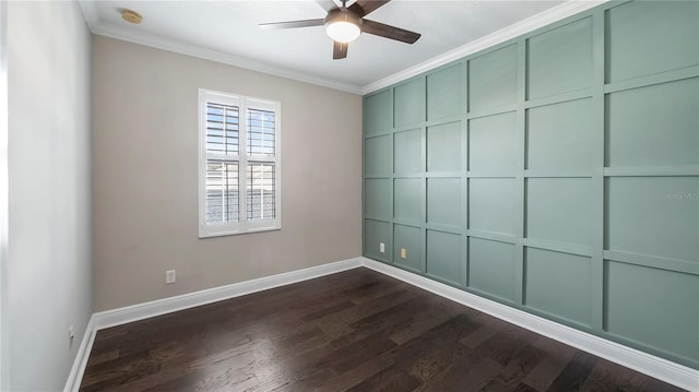 empty room featuring ornamental molding, dark wood-type flooring, and ceiling fan