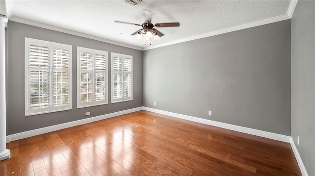 unfurnished room with hardwood / wood-style floors, a textured ceiling, ornamental molding, and ceiling fan