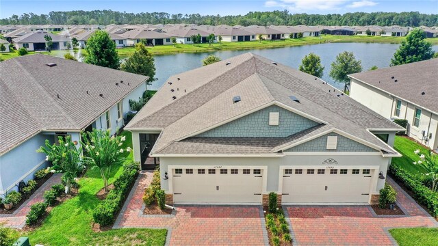 17597 Summersweet Way, Clermont, FL 34714 - aerial perspective of suburban area with a nearby body of water