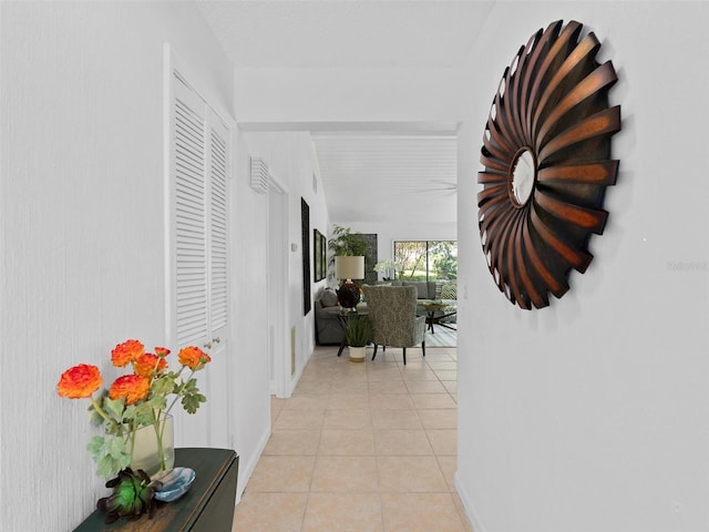 hallway featuring light tile patterned floors