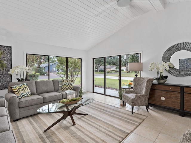 living room with beam ceiling, high vaulted ceiling, and light tile patterned floors