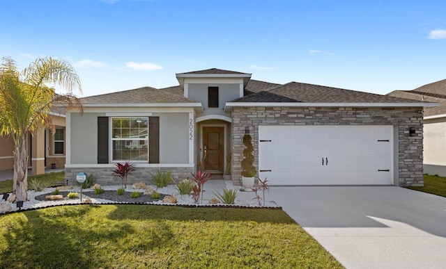 view of front of house featuring a garage and a front lawn