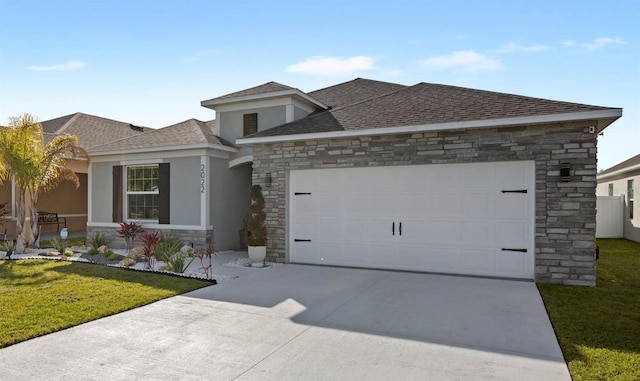 view of front of home with a garage and a front yard